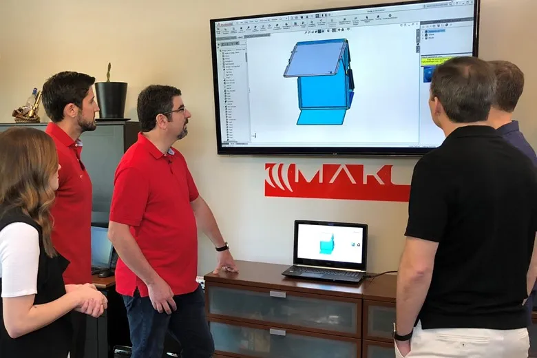 Kevin Mako Featured in Forbes: How to Get Your Invention to Market 1 MAKO team discussing how to invention design to market for client.