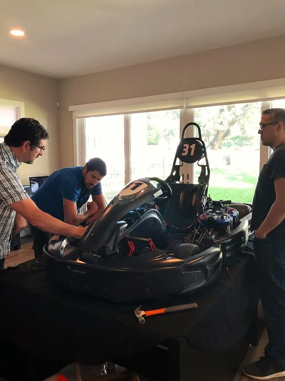 MAKO's, Kevin Mako, looking over a working prototype for a miniature racecar with Tim Uys, MAKO's Director of Design.